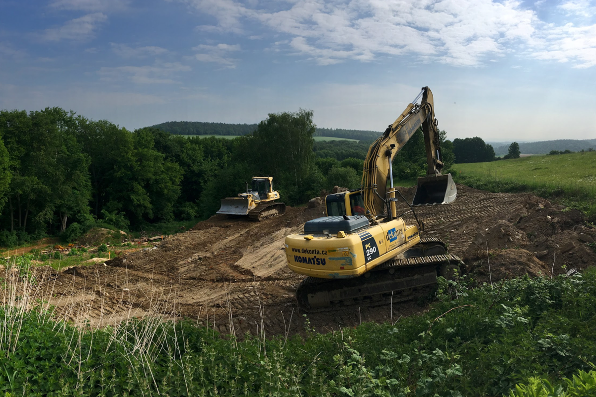 An excavator performing land modification